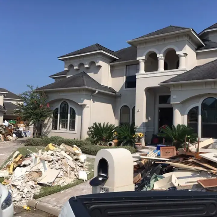 A dehumidifier and air mover drying a bathroom in a Lake Travis Hill Country home